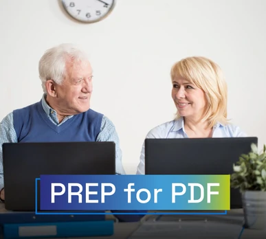 Older man and woman sitting in front of their laptops, smiling while working in an accessible environment. Overlaid text: "PREP for PDF".