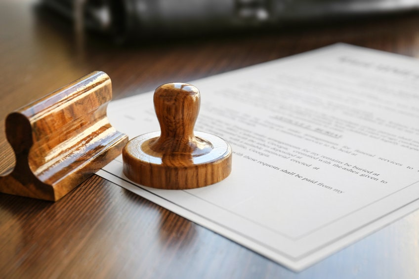 Sceau notarial apposé sur un document certifié.