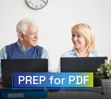 Older man and woman sitting in front of their laptops, smiling while working in an accessible environment. Overlaid text: "PREP for PDF".